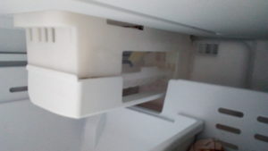 Ice-maker above the pull-out drawer